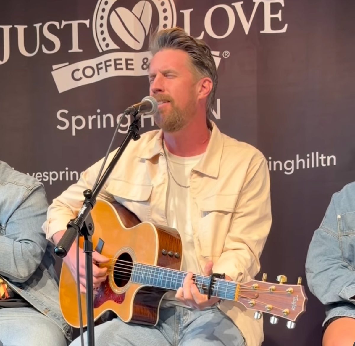 Solo songwriter with acoustic guitar