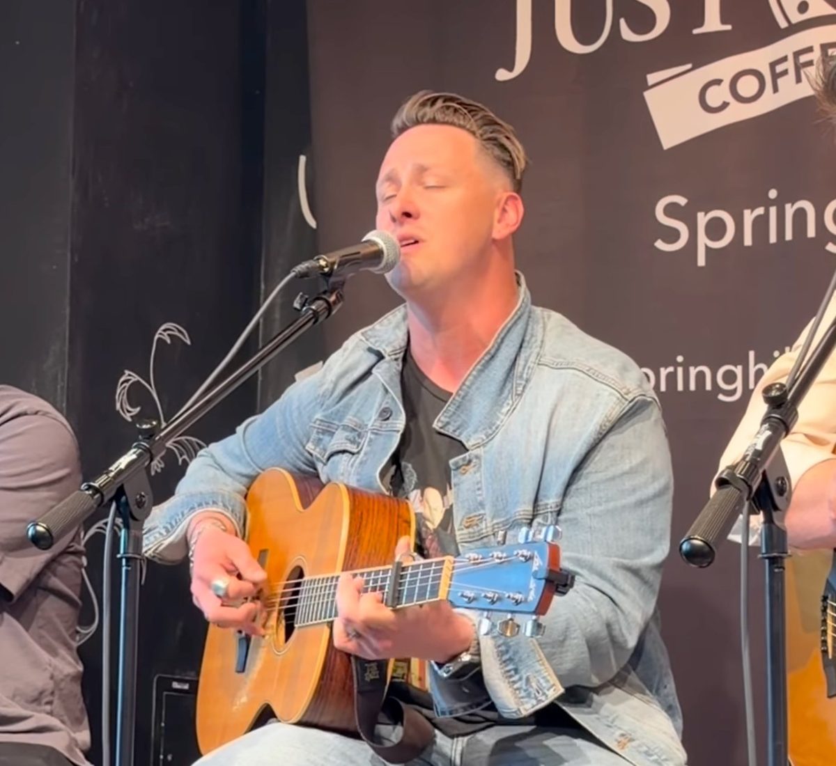 Solo singer with acoustic guitar