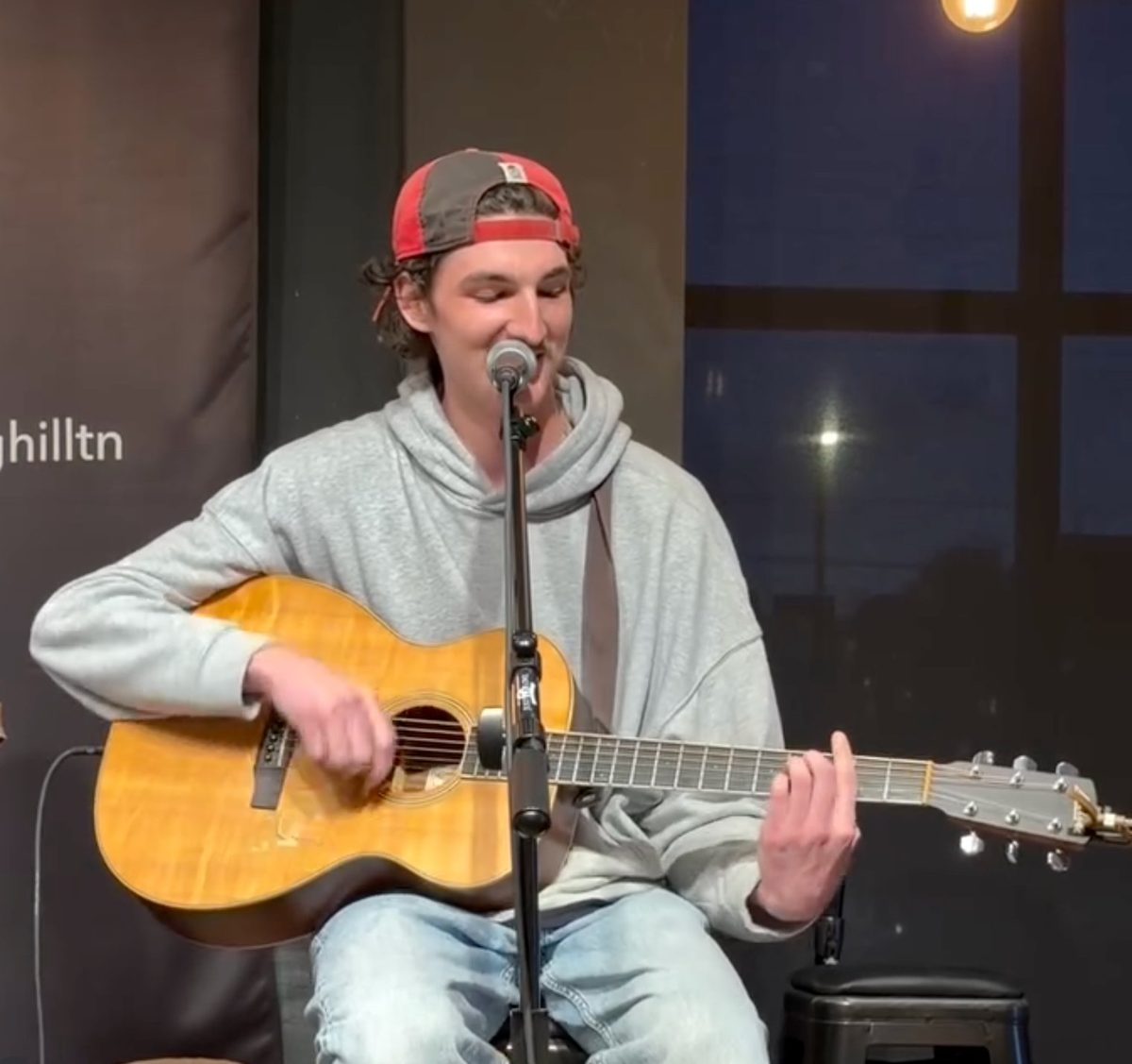 Young songwriter performing